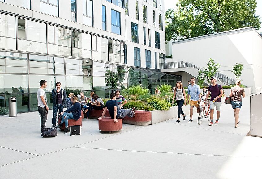 Students in the courtyard of the Journalism and Communication Studies' building.