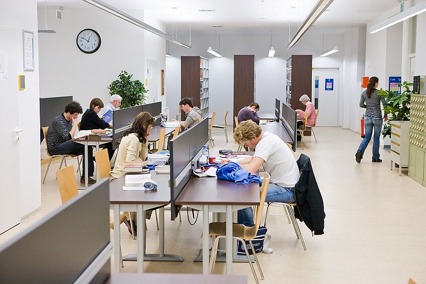Students learning in a reading room.