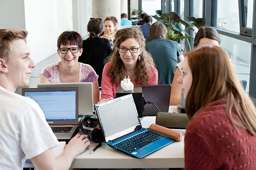 Students working on the laptop